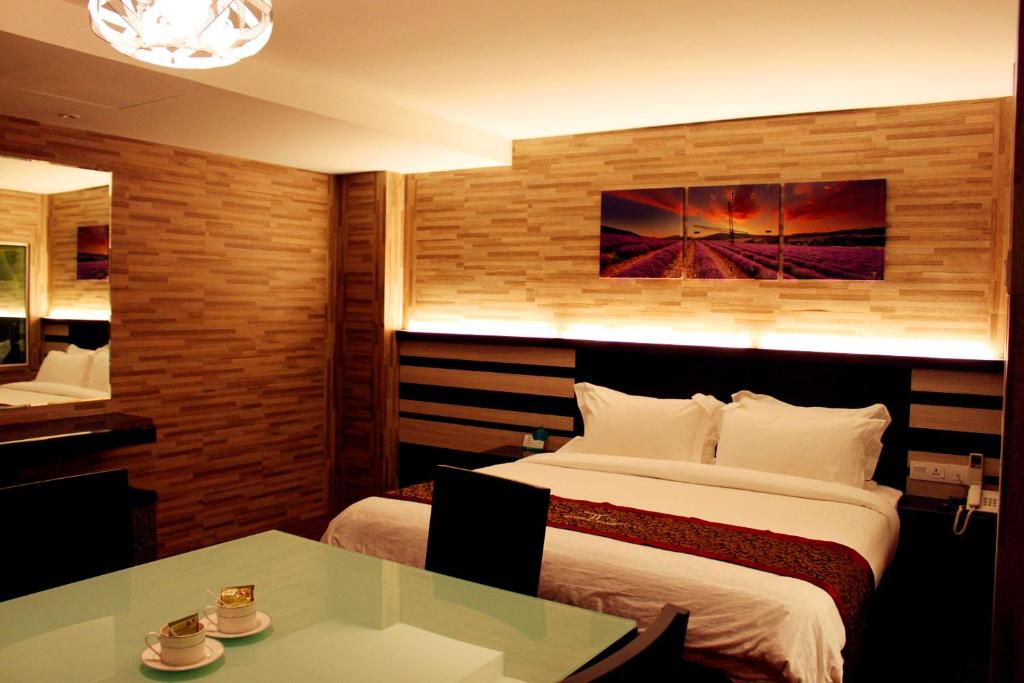 Postel nebo postele na pokoji v ubytování Hotel Time Boutique Nilai