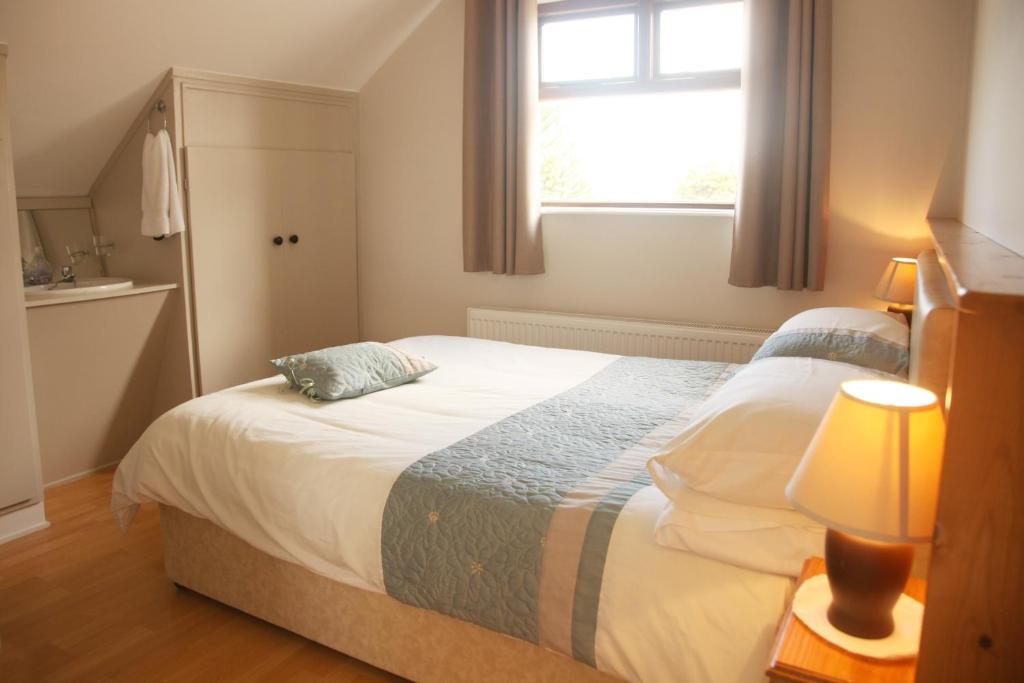 Postel nebo postele na pokoji v ubytování Torine House B&B