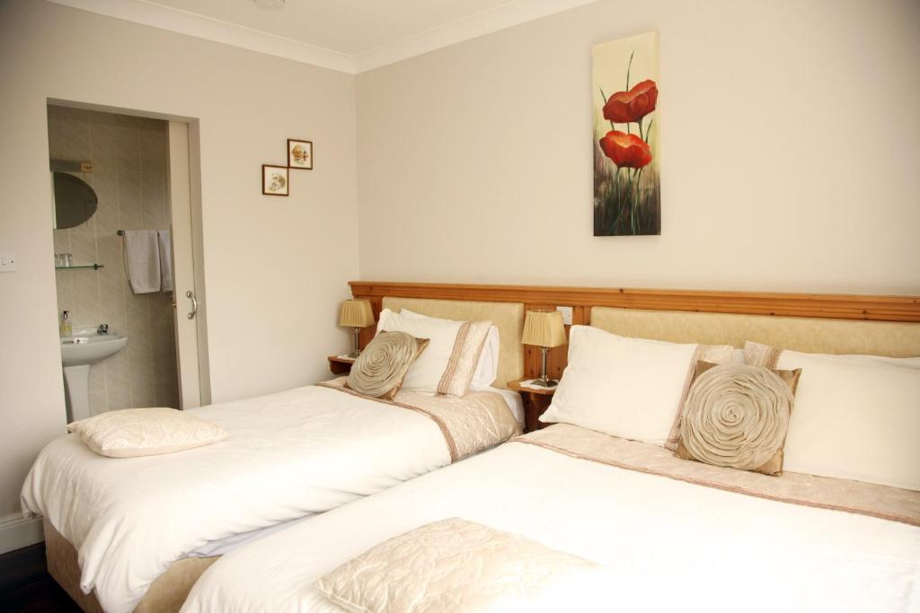 Postel nebo postele na pokoji v ubytování Torine House B&B