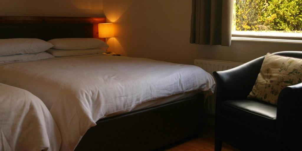 Postel nebo postele na pokoji v ubytování Torine House B&B