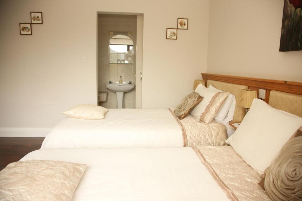 Postel nebo postele na pokoji v ubytování Torine House B&B