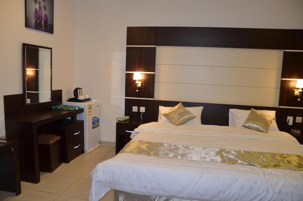 Postel nebo postele na pokoji v ubytování Jazan Heart Hotel