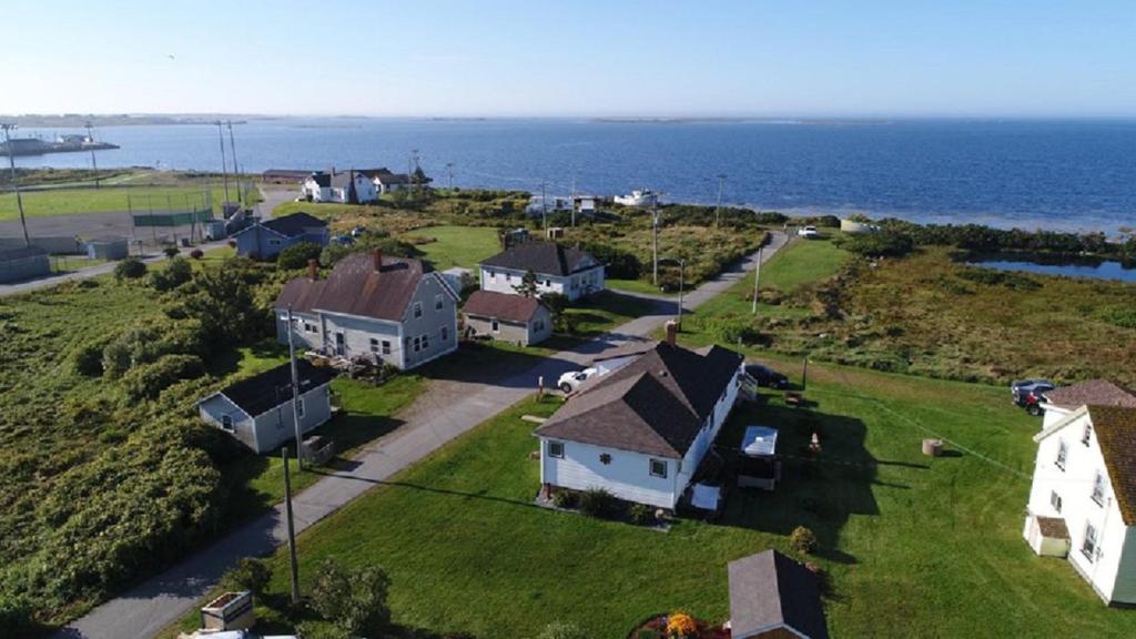 an aerial view of a house and the ocean at Mama`s By The Sea B&B in Clark's Harbour