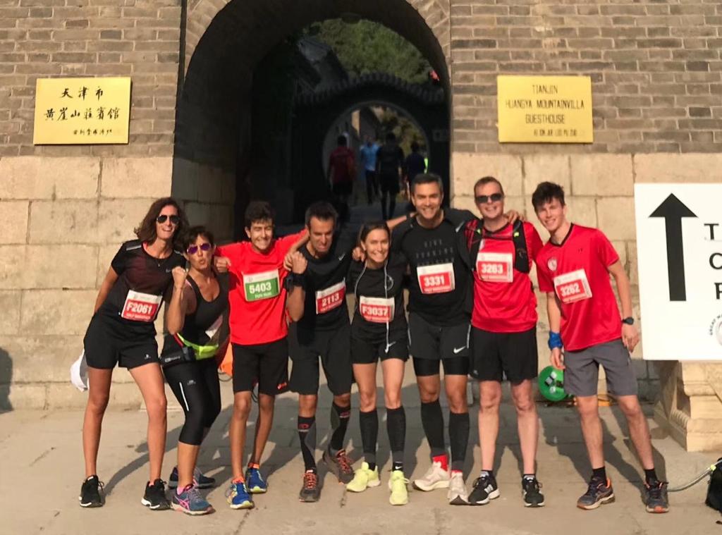 a group of people posing for a picture at a race at Tianjin Huangyaguan Great Wall Home Hotel in Jizhou