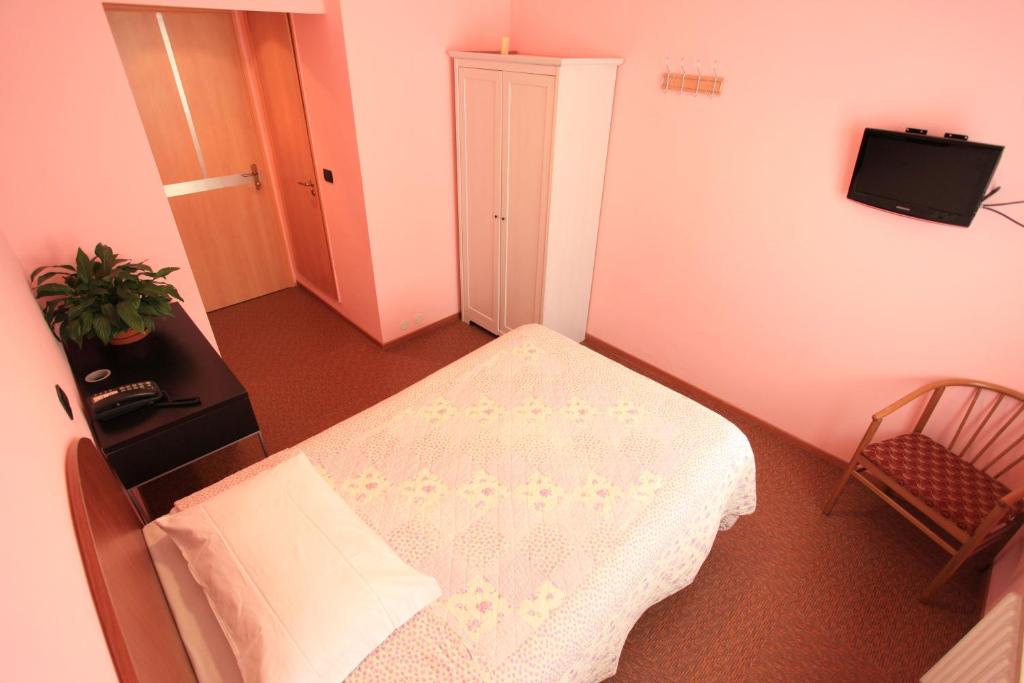 Postel nebo postele na pokoji v ubytování Hotel Torrismondi
