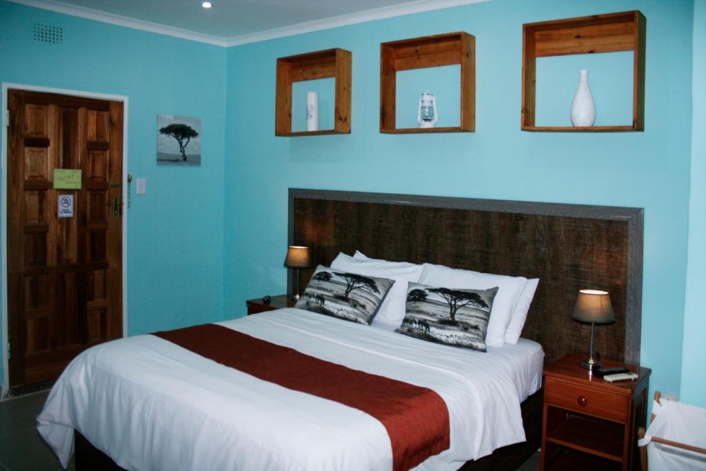 Кровать или кровати в номере Serowe Hotel