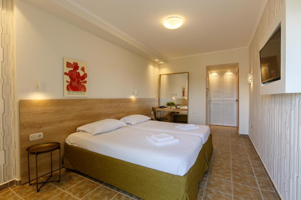 Un ou plusieurs lits dans un hébergement de l'établissement Marialena Hotel