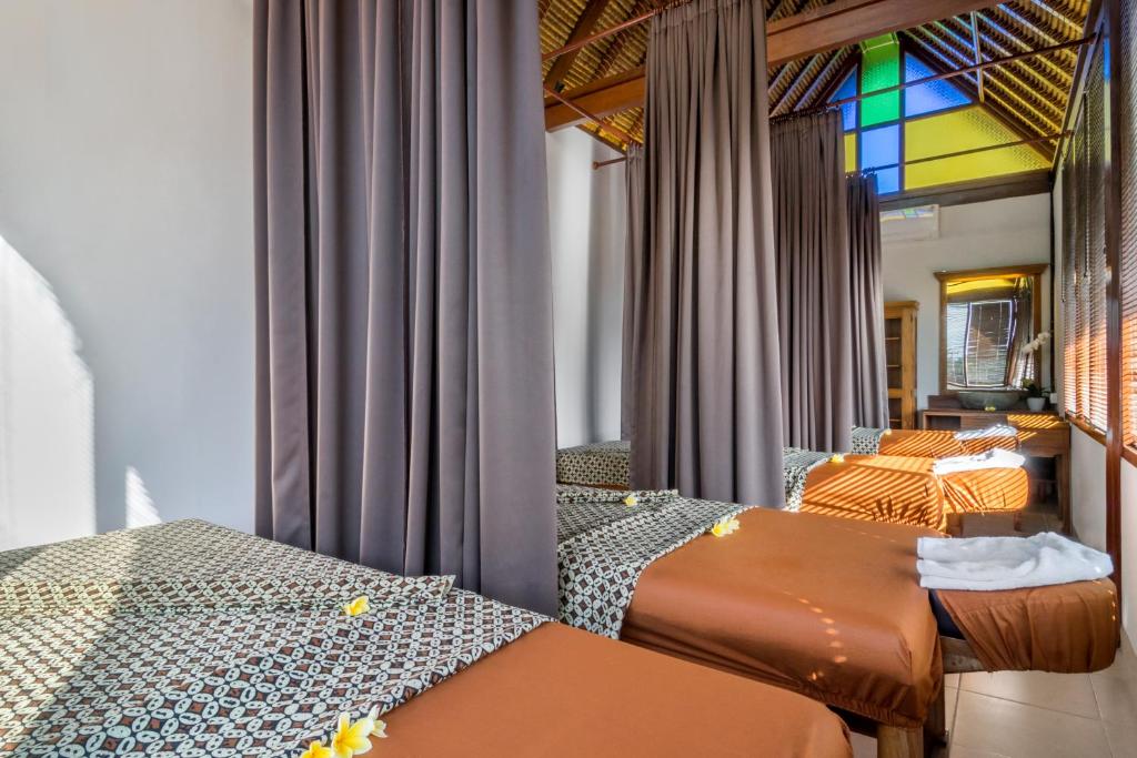 Postel nebo postele na pokoji v ubytování Bumi Muwa Ubud Katiklantang