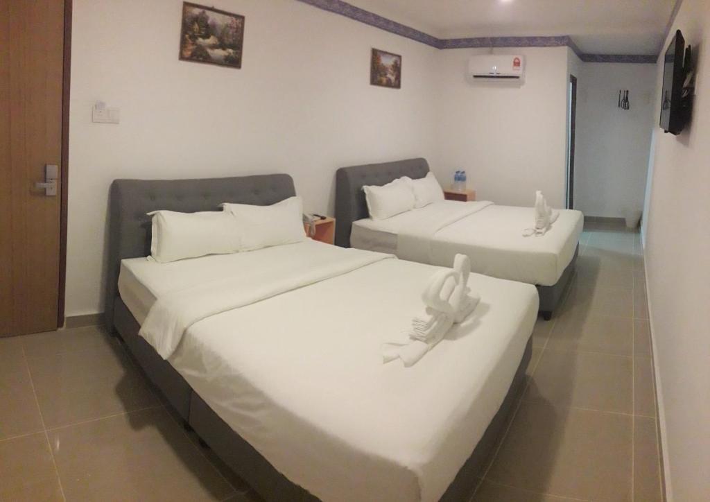 Postel nebo postele na pokoji v ubytování Shobi Hotel Johor Bahru Near CIQ JB