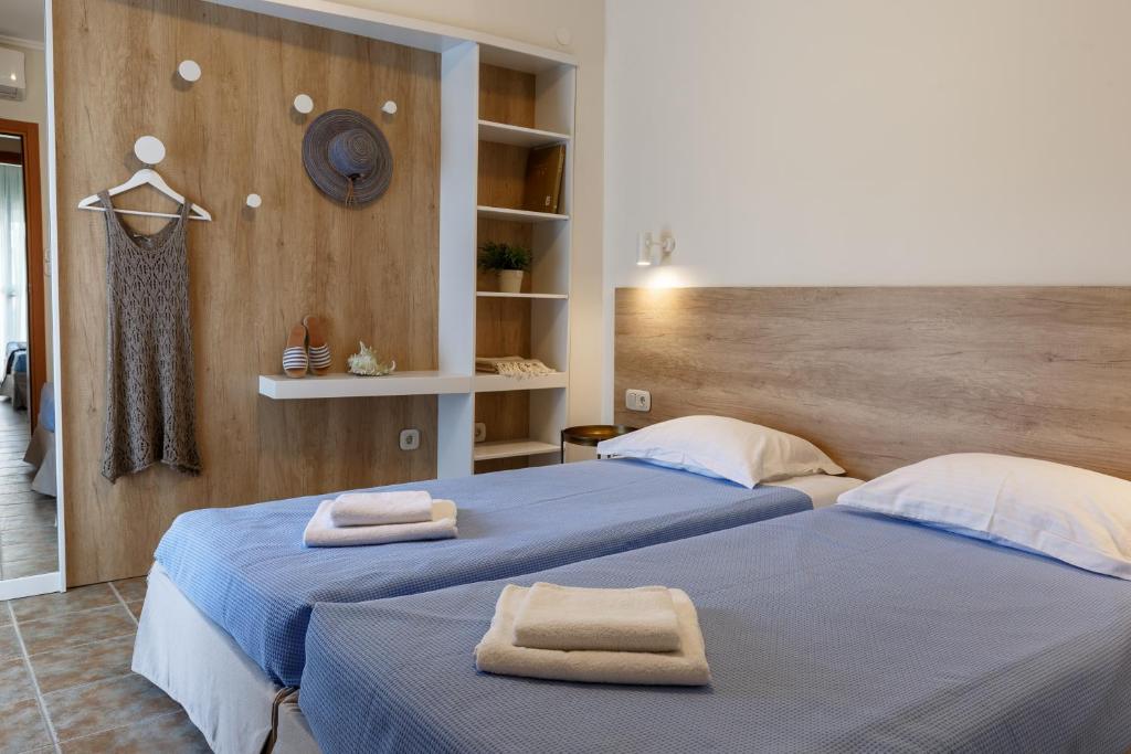 Postel nebo postele na pokoji v ubytování Marialena Hotel