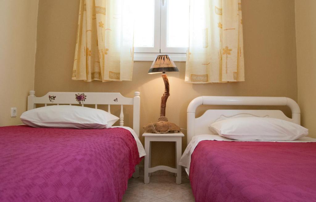 Postel nebo postele na pokoji v ubytování Fiora Villas