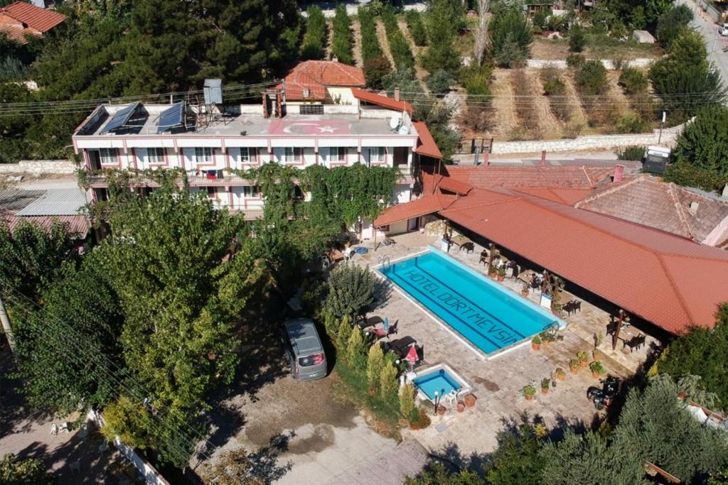 an aerial view of a house with a swimming pool at Hotel Dort Mevsim in Pamukkale