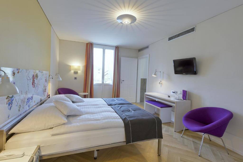 Postel nebo postele na pokoji v ubytování Boutique Hotel Bellevue
