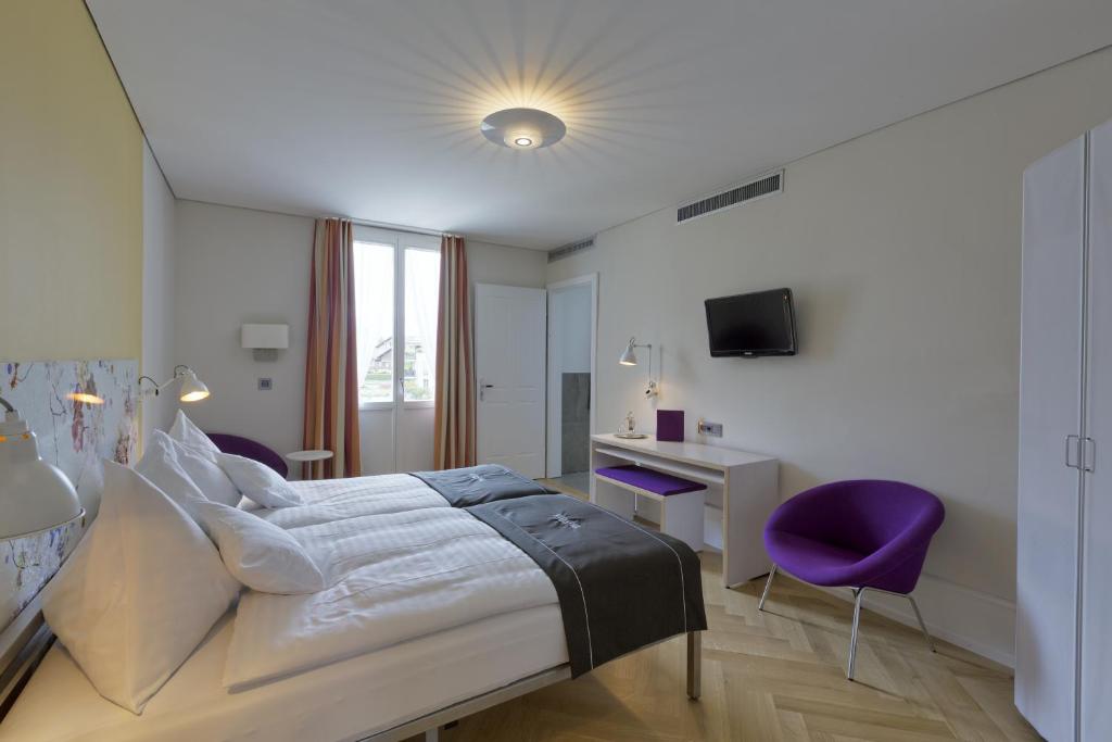 Postel nebo postele na pokoji v ubytování Boutique Hotel Bellevue
