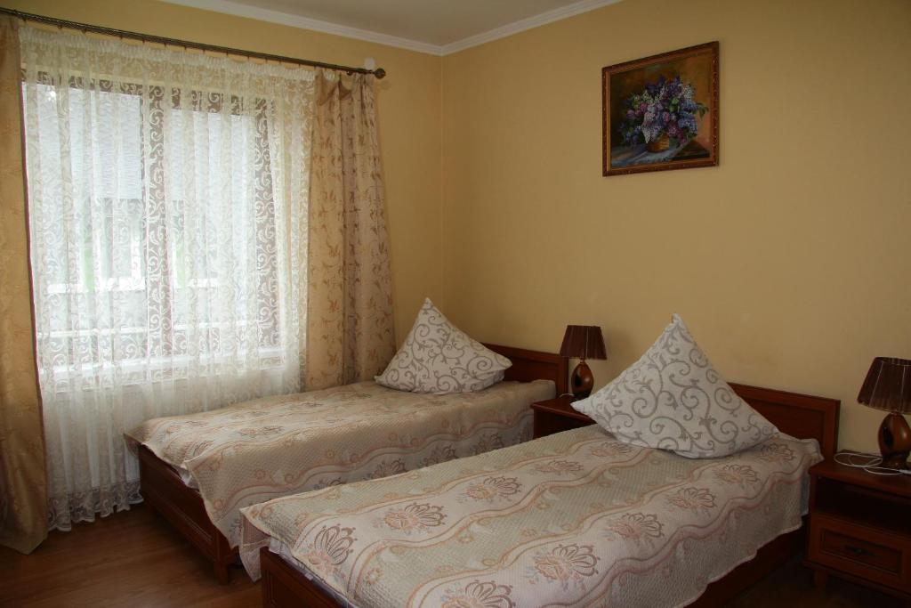 Postel nebo postele na pokoji v ubytování Pyate Koleso
