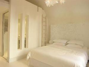 Letto o letti in una camera di "Un Lieu Unique" Le Lodge et le Dolce