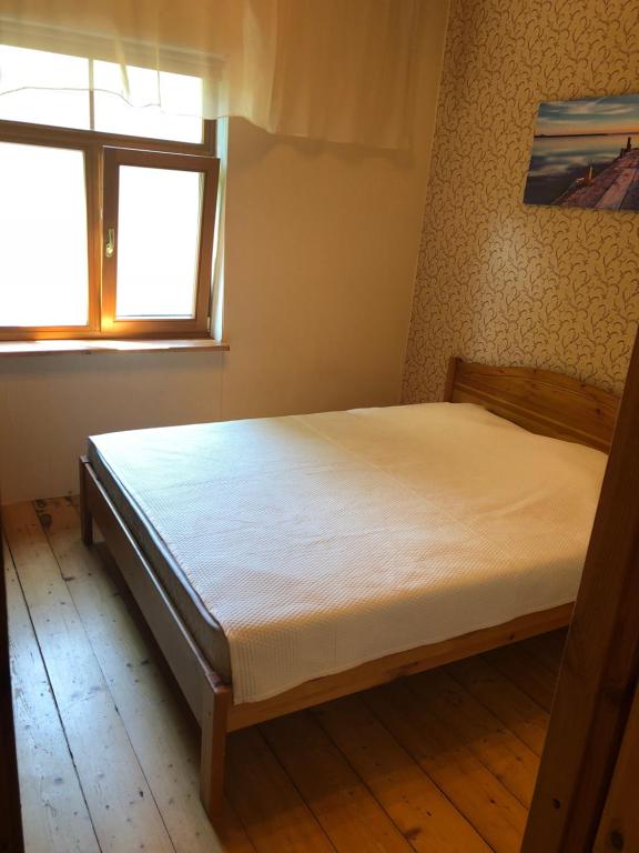 Postel nebo postele na pokoji v ubytování Nõmme Apartments