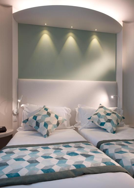 Postel nebo postele na pokoji v ubytování Ark Hotel