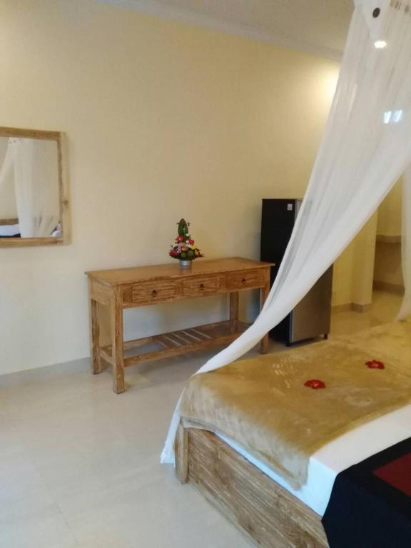 Postel nebo postele na pokoji v ubytování Qiul Guest House
