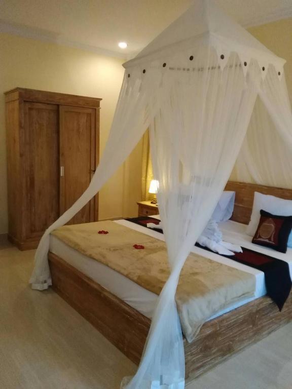 Postel nebo postele na pokoji v ubytování Qiul Guest House