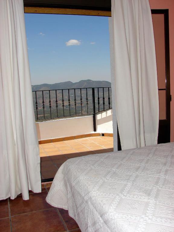Cama o camas de una habitación en Apartamentos Sierra de Segura