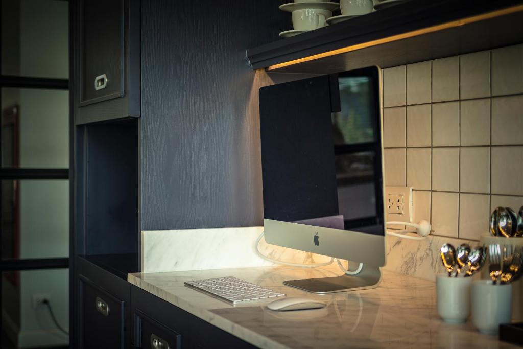 An iMac workstation built into the kitchen counter.