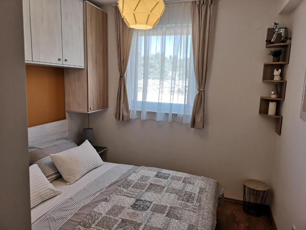 Posteľ alebo postele v izbe v ubytovaní Natalija
