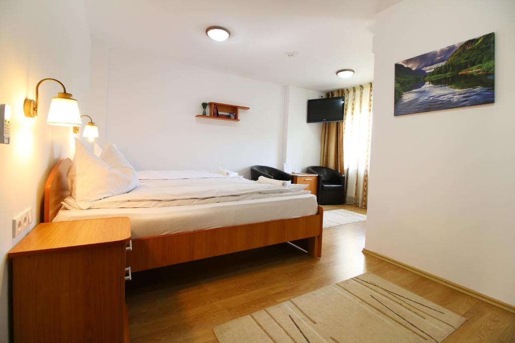 Postel nebo postele na pokoji v ubytování Casa Micu