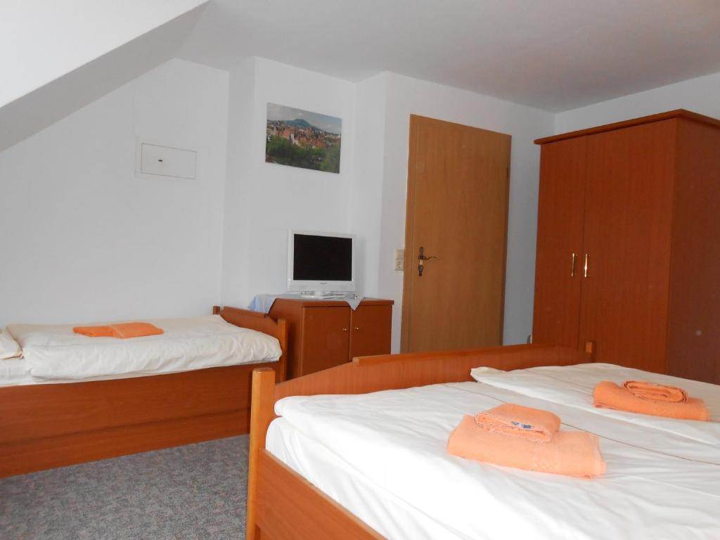 Postel nebo postele na pokoji v ubytování Goldener Engel /Pension