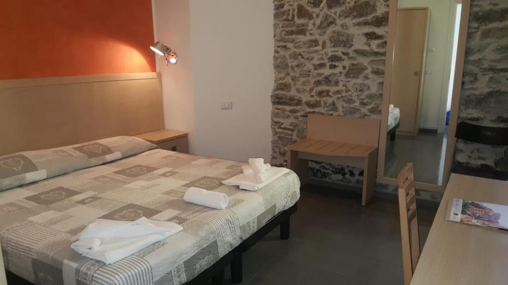 Postel nebo postele na pokoji v ubytování Hotel La Zorza