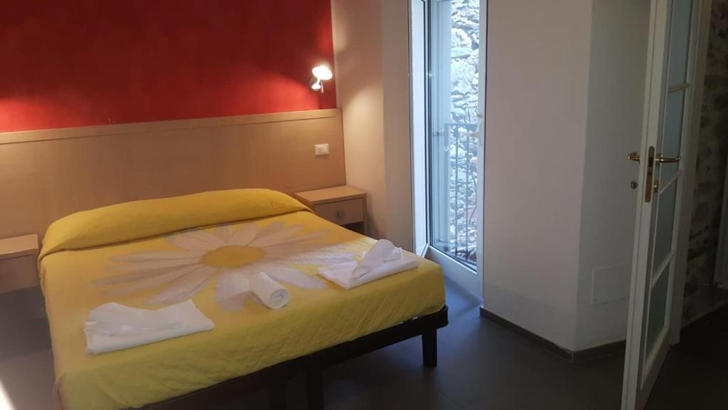 Postel nebo postele na pokoji v ubytování Hotel La Zorza