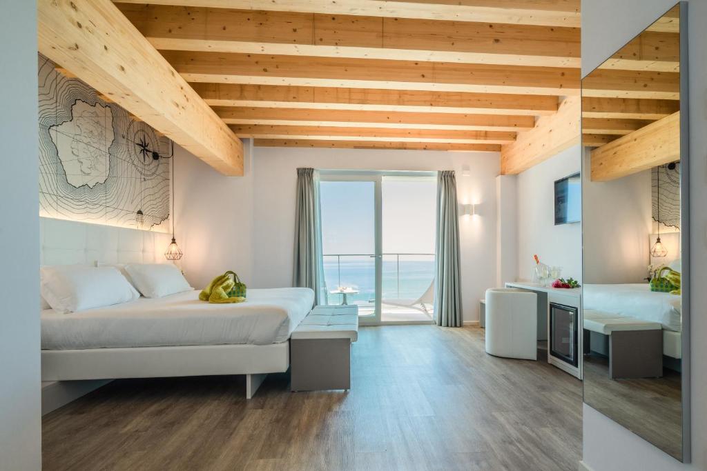 Postel nebo postele na pokoji v ubytování Hotel Elite