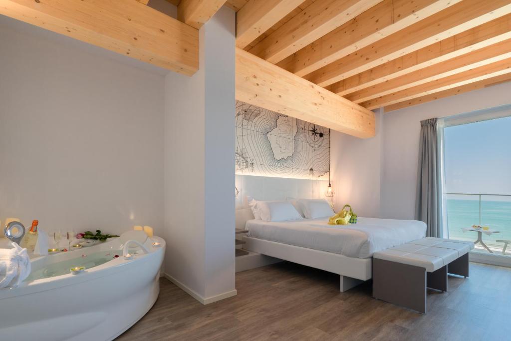 Postel nebo postele na pokoji v ubytování Hotel Elite