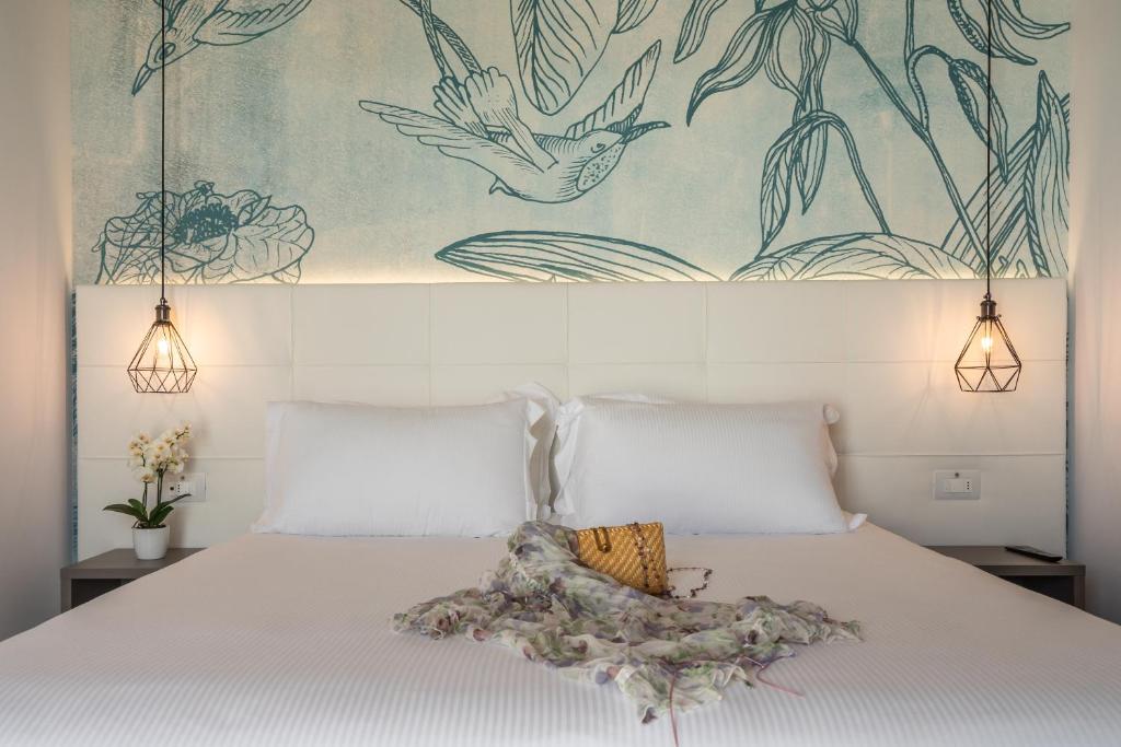 Postel nebo postele na pokoji v ubytování Hotel Elite