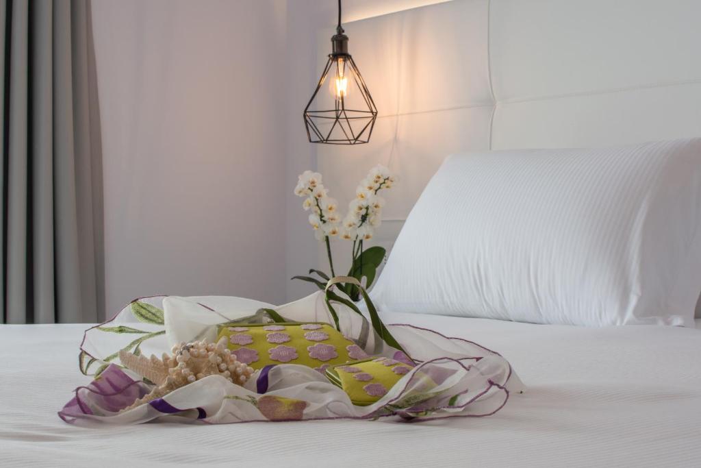 Postel nebo postele na pokoji v ubytování Hotel Elite