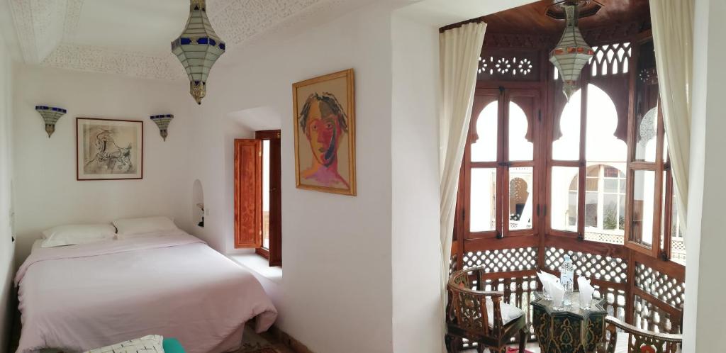 Postel nebo postele na pokoji v ubytování Riad Ben Youssef