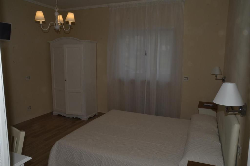 Postel nebo postele na pokoji v ubytování L’OPERÀ