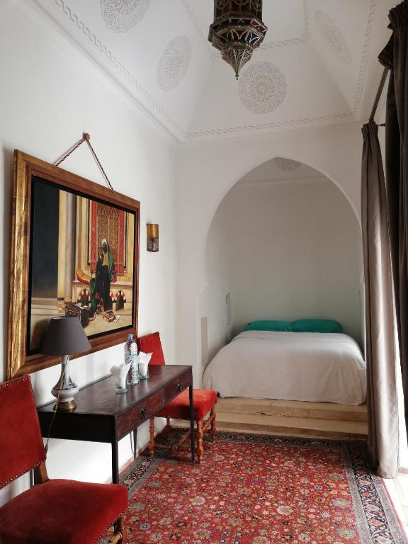 Postel nebo postele na pokoji v ubytování Riad Ben Youssef