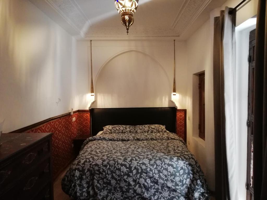 Postel nebo postele na pokoji v ubytování Riad Ben Youssef