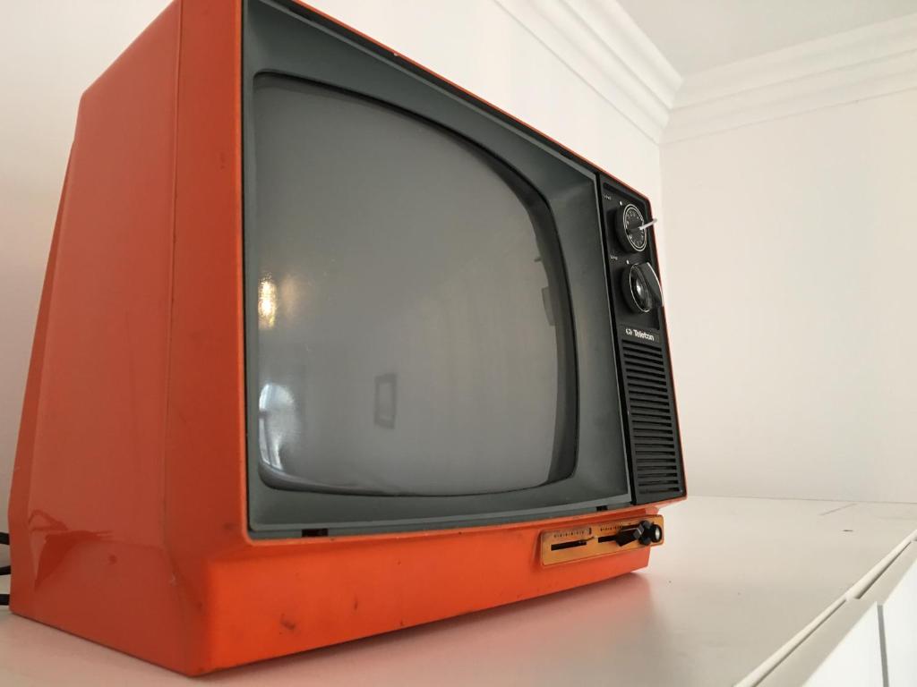 Televízia a/alebo spoločenská miestnosť v ubytovaní Queen Bed Central Budapest