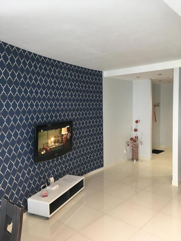 TV a/nebo společenská místnost v ubytování JAB Apartments Bandurskiego Business & Family