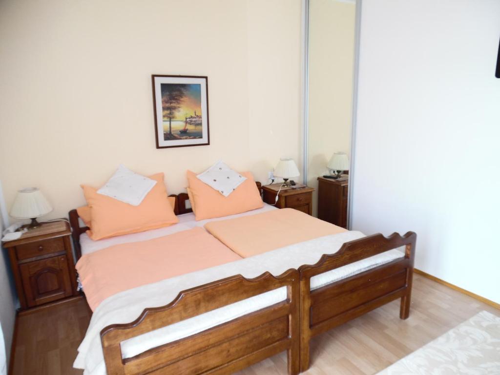 Postel nebo postele na pokoji v ubytování Apartments Fina