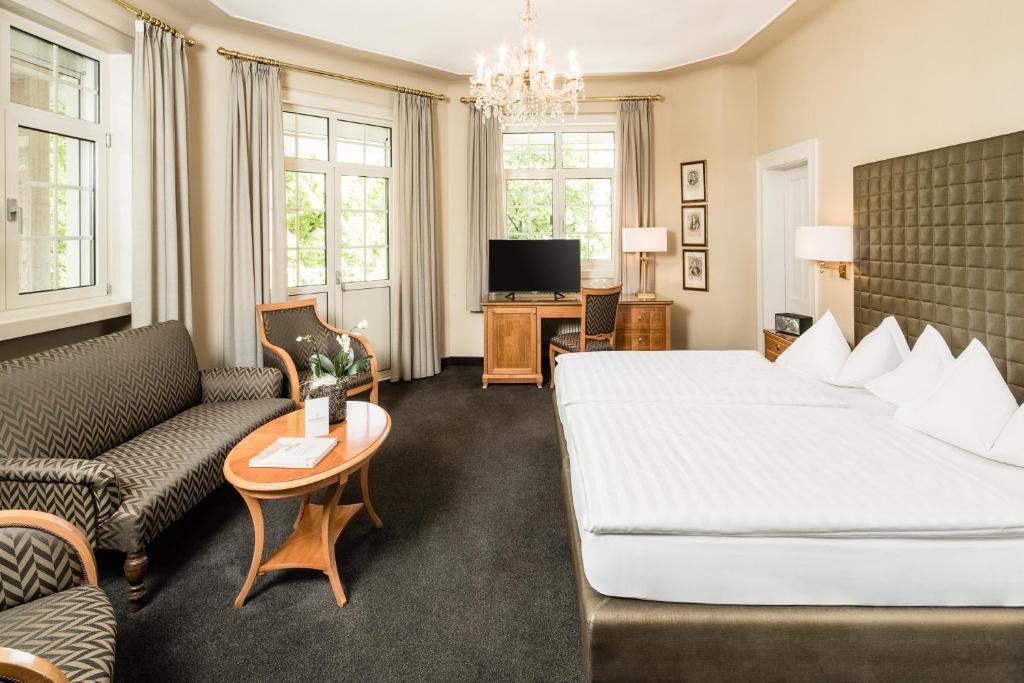 Postel nebo postele na pokoji v ubytování Classic Hotel Meranerhof