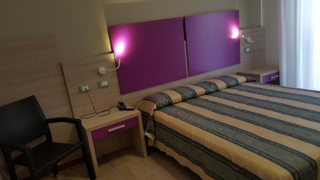 Postel nebo postele na pokoji v ubytování Hotel Ca' D'Oro
