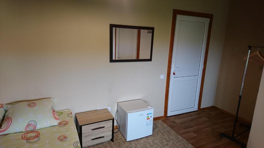 Postel nebo postele na pokoji v ubytování Guest House Dacha