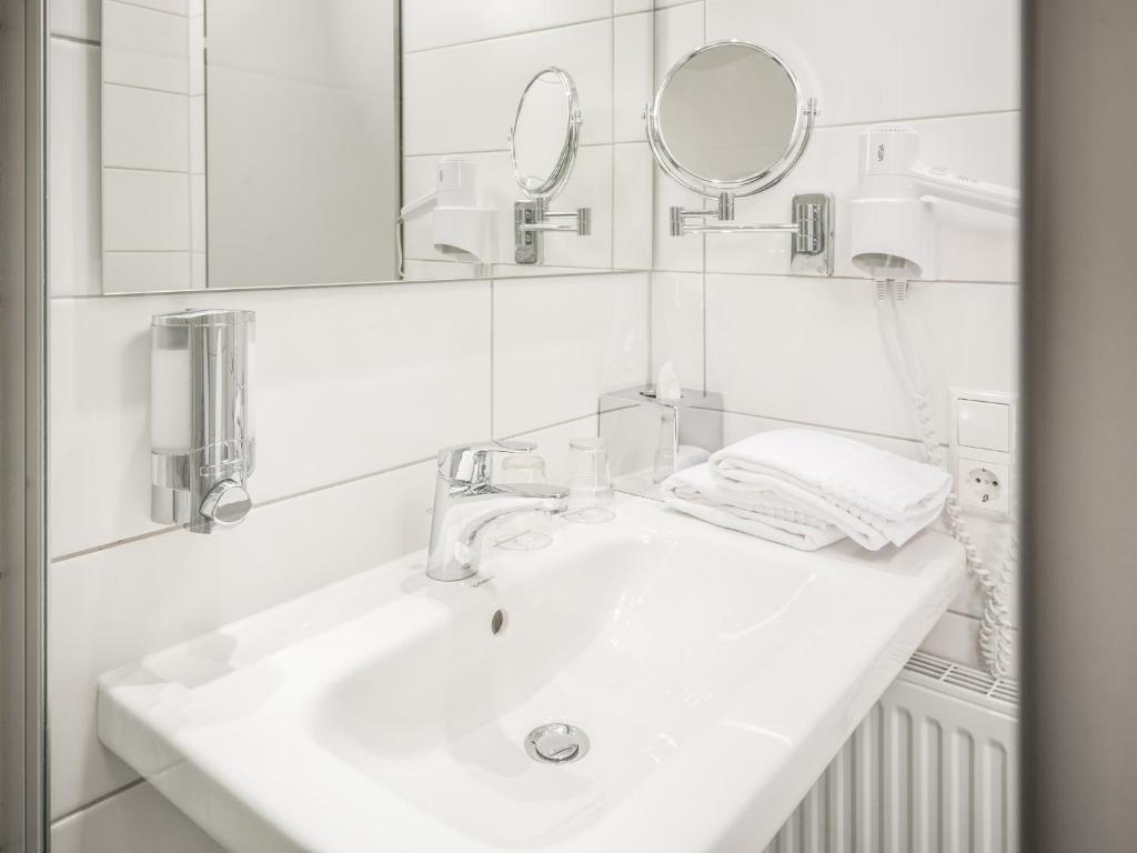 Koupelna v ubytování viavelo hotel