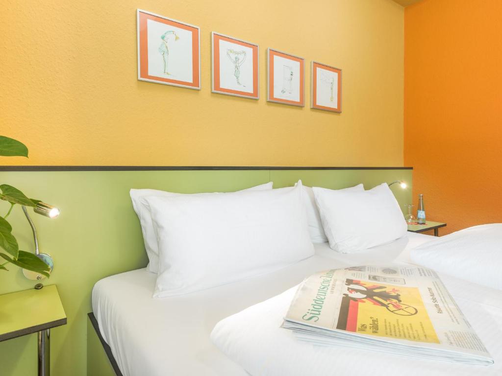 Postel nebo postele na pokoji v ubytování viavelo hotel