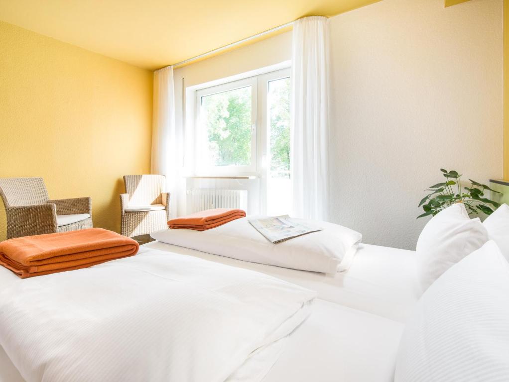Postel nebo postele na pokoji v ubytování viavelo hotel