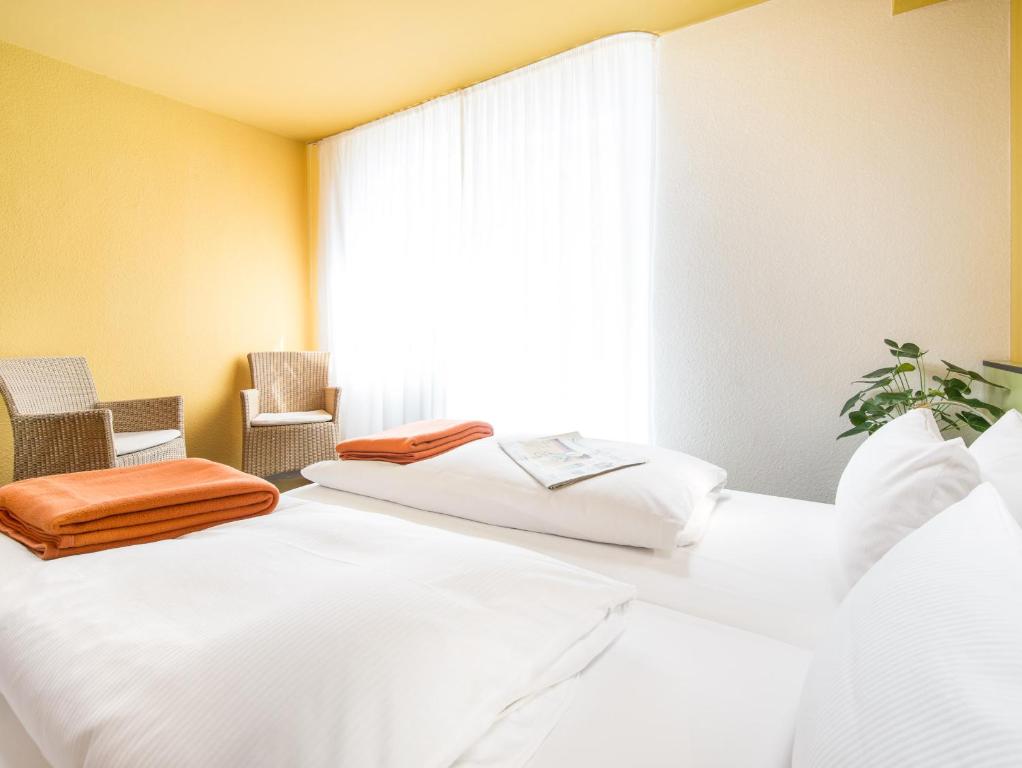 Postel nebo postele na pokoji v ubytování viavelo hotel
