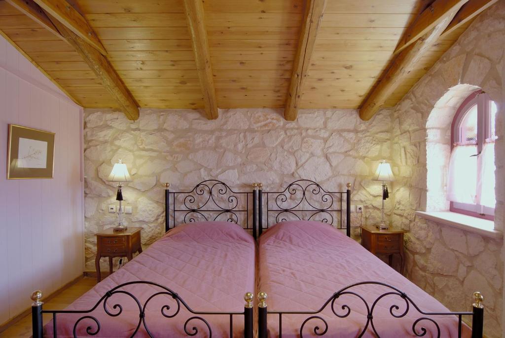 A bed or beds in a room at Aresti Mountain Resort